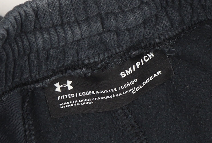 Brand and care label for Under Armour boys’ black coldgear jogger sweatpants, size S, fitted