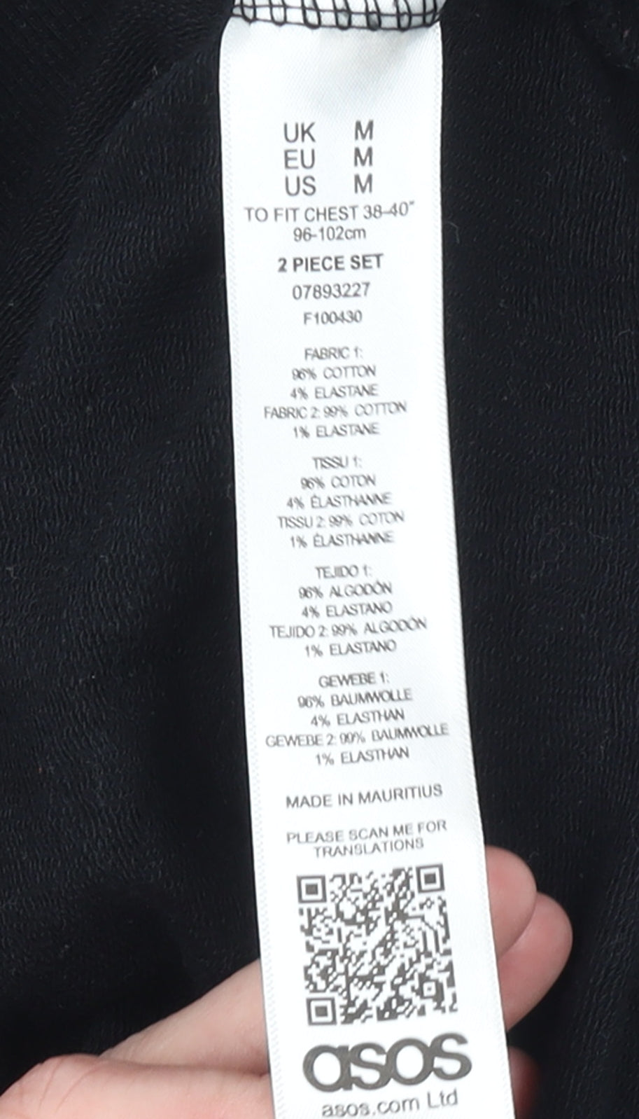 Brand and care label for ASOS women’s black & white pullover hoodie cotton blend, size M