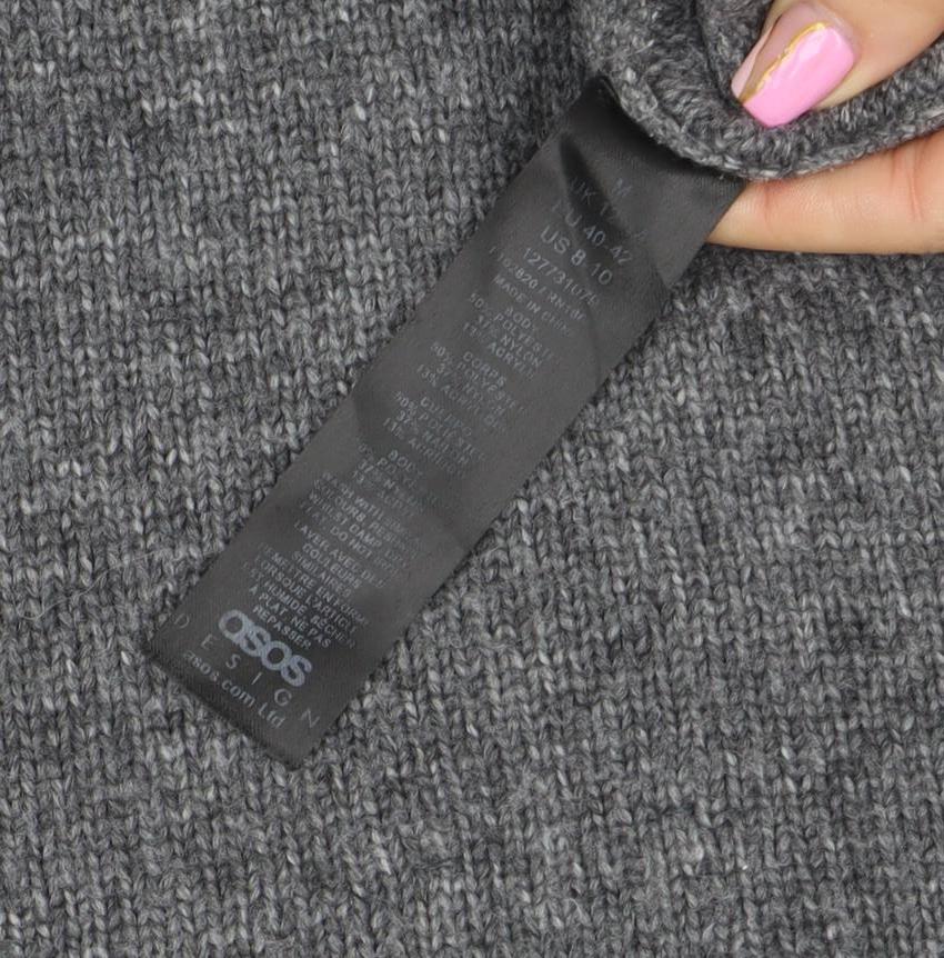 Brand and care label for ASOS women’s grey mock neck wool blend relaxed fit jumper, size UK 14