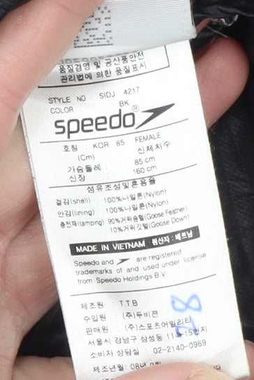 Brand and care label for Speedo Women's Black Puffer Jacket, size 10, Insulated Lightweight