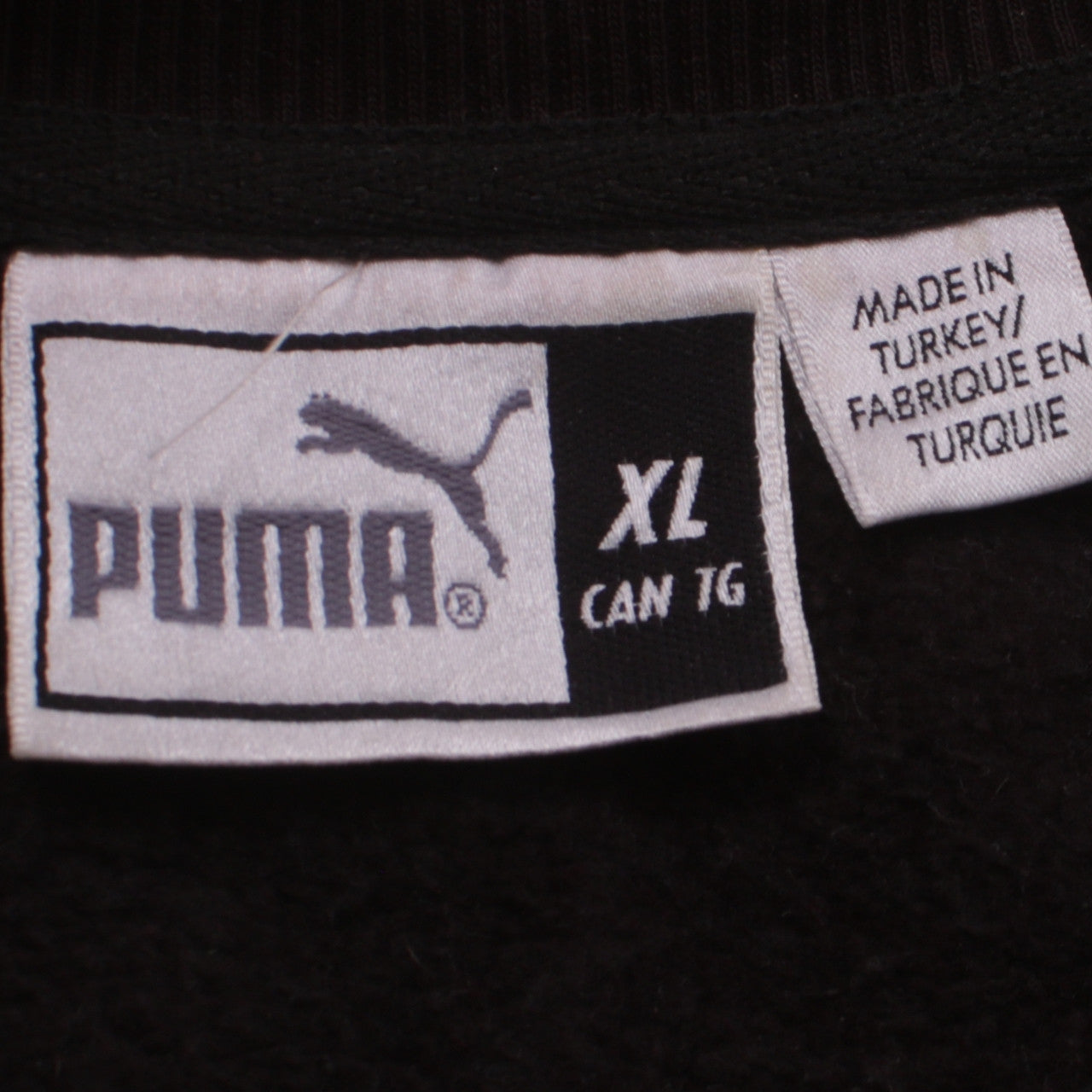 Close-up detail of Puma Men's Black XL Crew Neck Pullover Sweatshirt