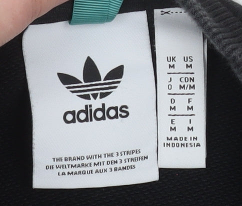 Brand and care label for Adidas Men's Black Graphic Pullover Sweatshirt Medium
