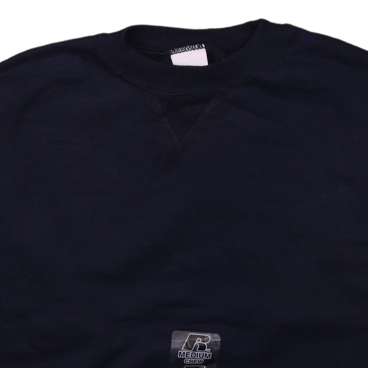 Brand and care label for Russell Athletic boys’ black medium pullover crew neck sweatshirt