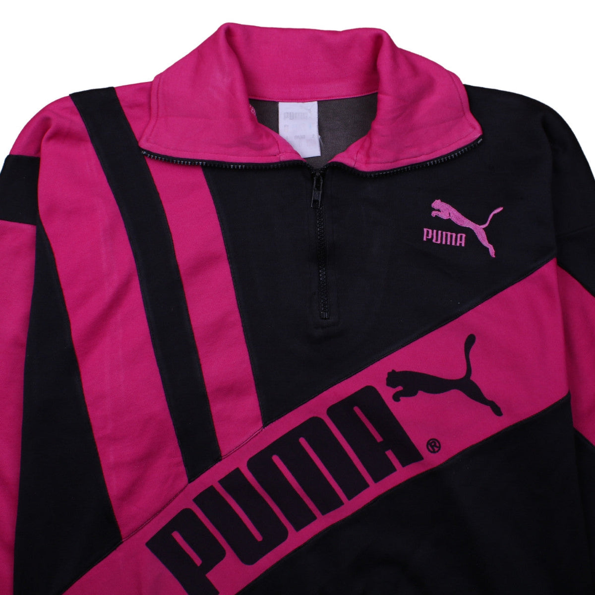 Brand and care label for Puma women’s black pink 1/2 zip pullover sweatshirt, size L