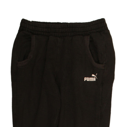 Brand and care label for Puma women’s black jogger sweatpants, size UK 8, fleece activewear
