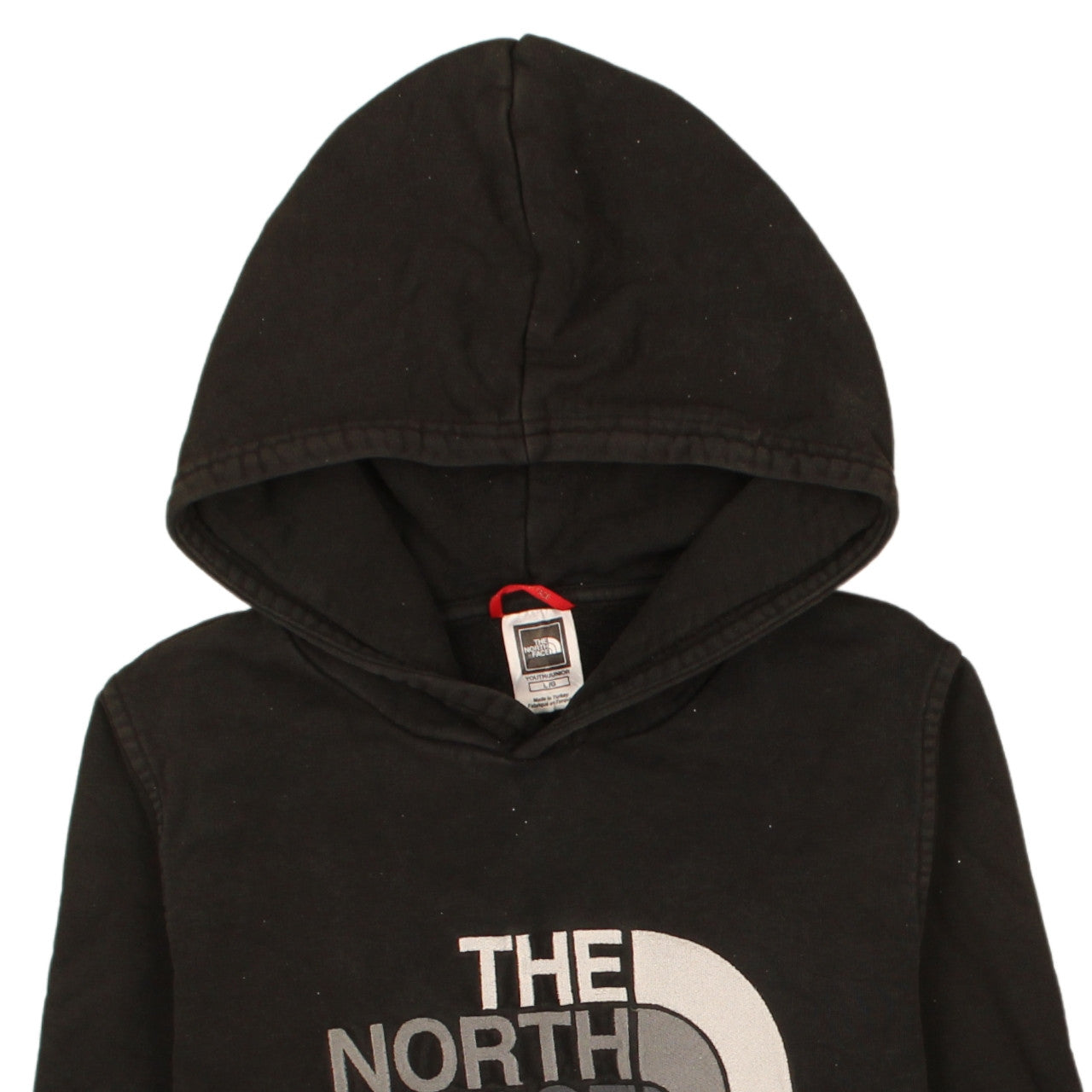Brand and care label for The North Face boys’ black pullover hoodie l logo fleece sweatshirt