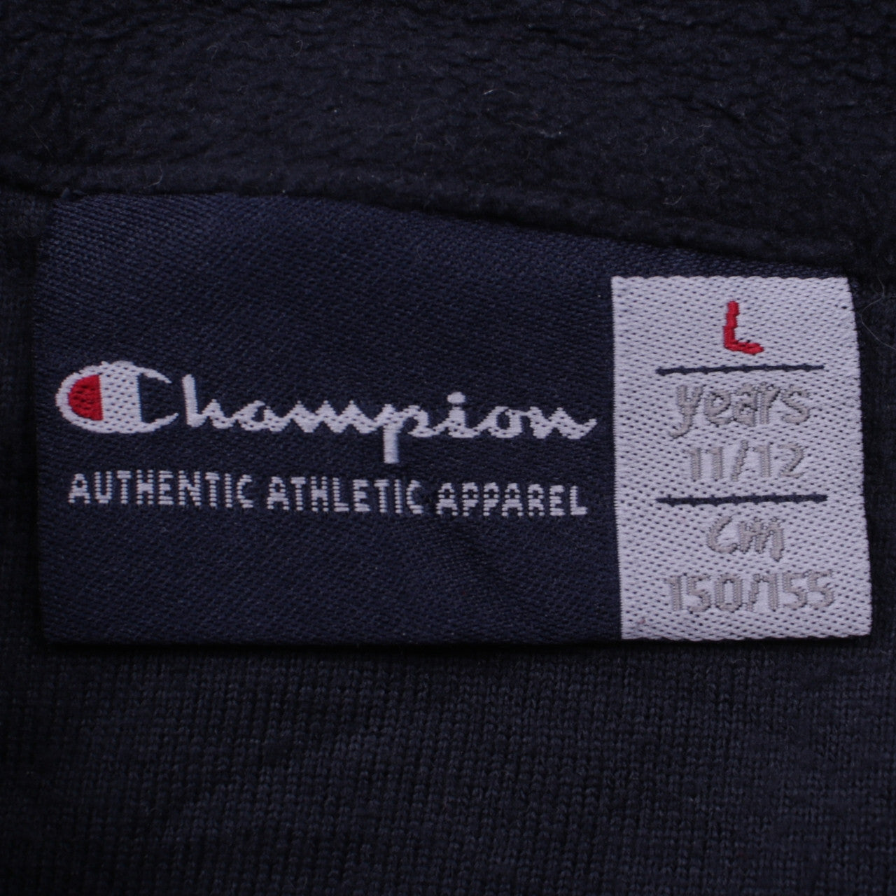 Close-up detail of Champion boys’ black fleece 1/4 zip sweatshirt, size 11-12, years