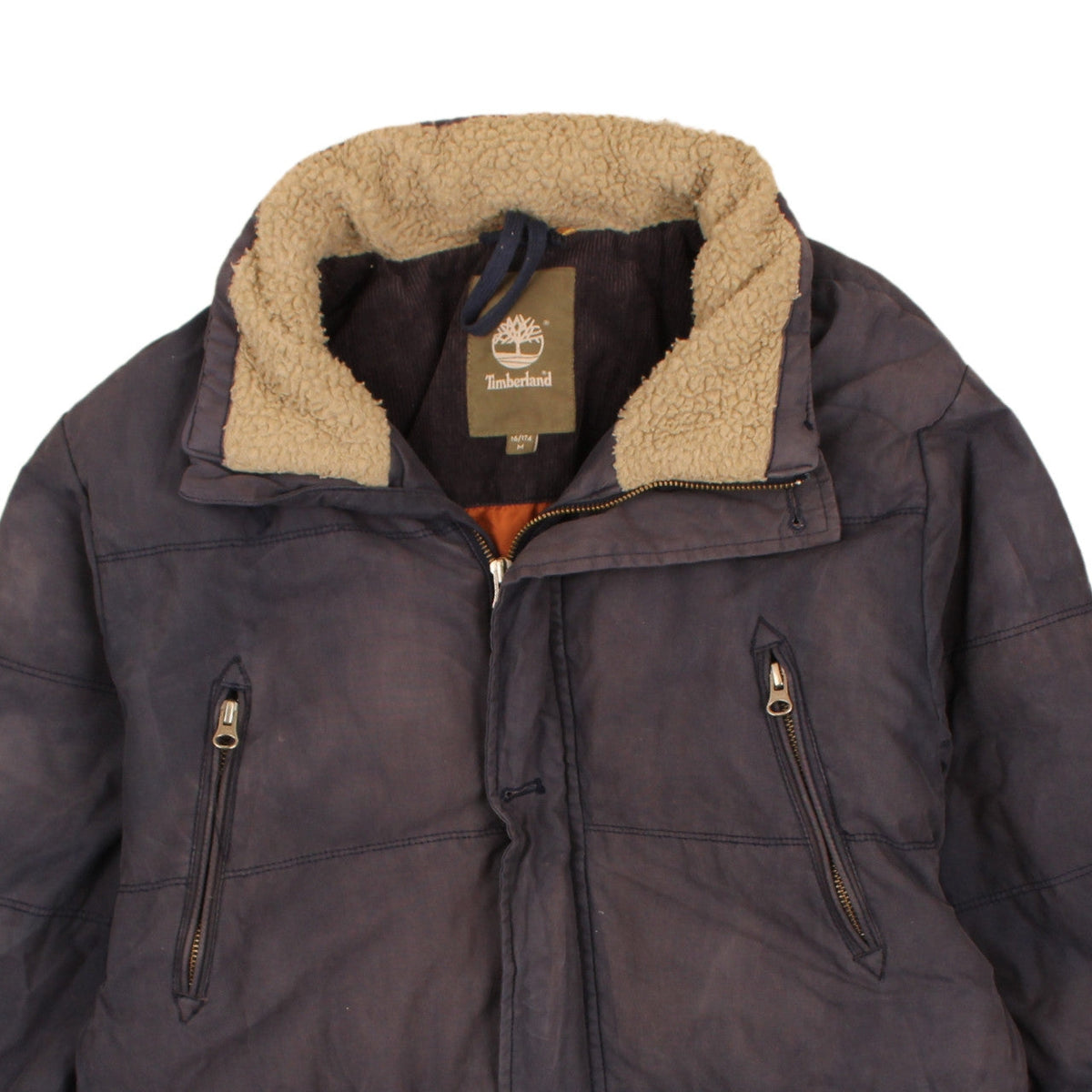 Brand and care label for Timberland boys’ blue 16 years winter puffer jacket with faux fur lining