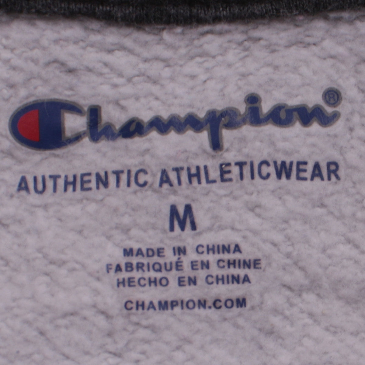 Close-up detail of Champion boys’ grey pullover hoodie m fleece lined logo sweatshirt
