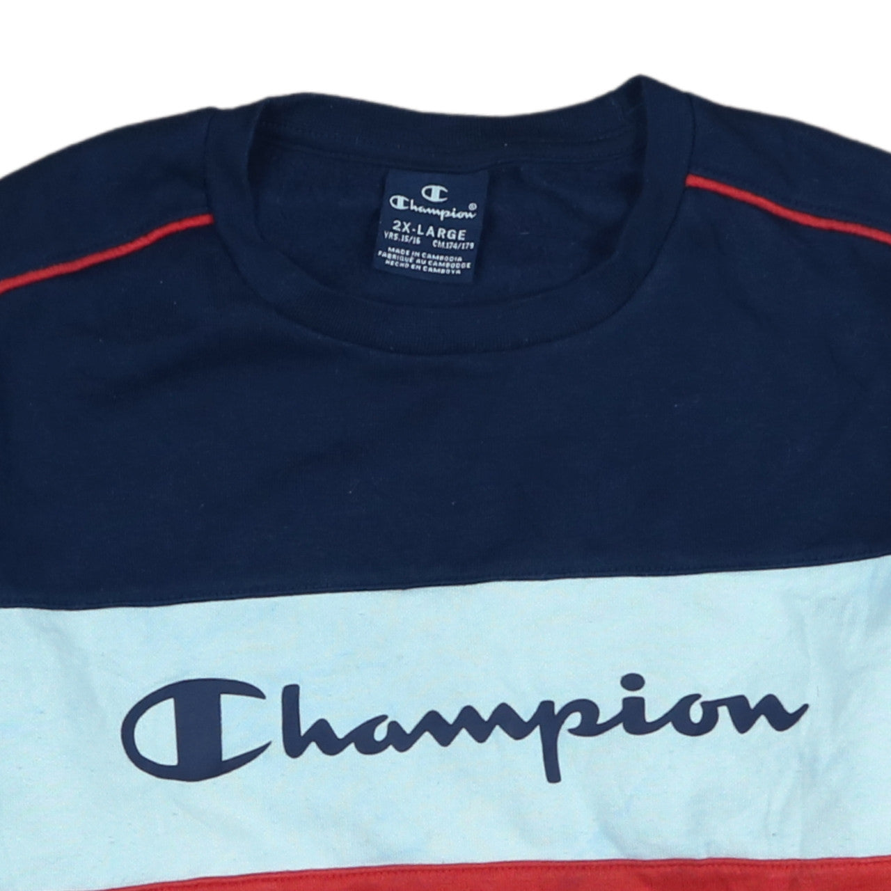 Brand and care label for Champion boys’ navy red colourblock crew neck sweatshirt 15-16 years 2xl