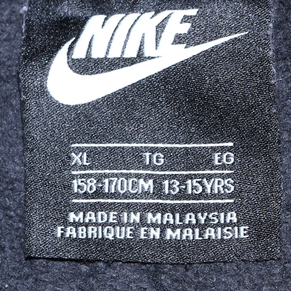 Close-up detail of Nike boys’ black full zip fleece hoodie xl 13-15 years sportswear