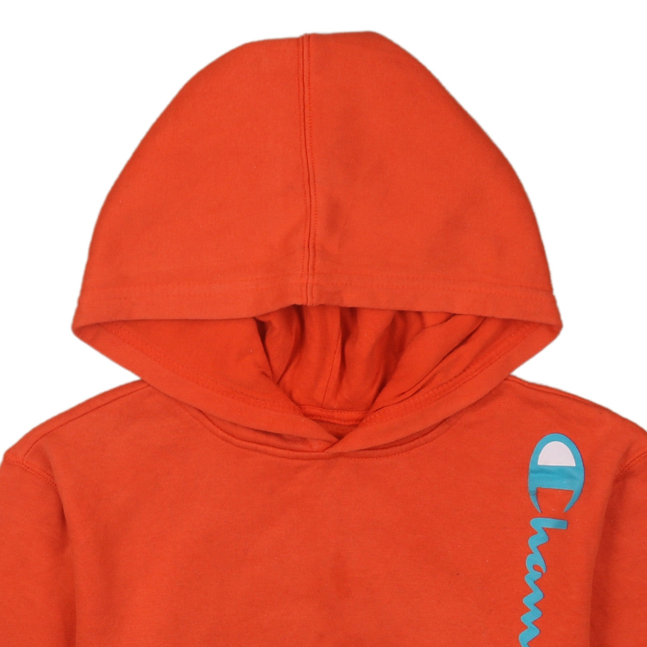 Brand and care label for Champion boys’ orange pullover hoodie, size L, cotton blend fleece sweatshirt
