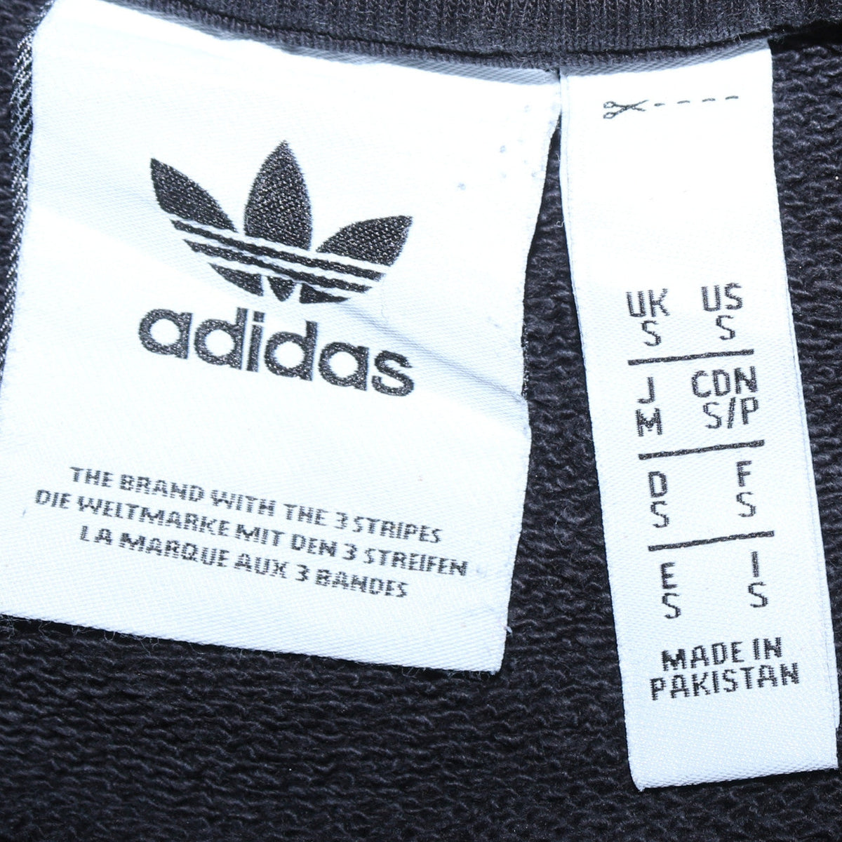 Close-up detail of Adidas Men's Black Crew Neck Pullover Sweatshirt, size S