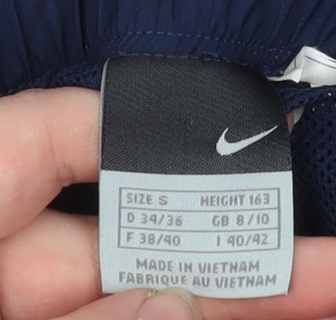 Brand and care label for Nike boys’ blue track pants s lightweight activewear trousers