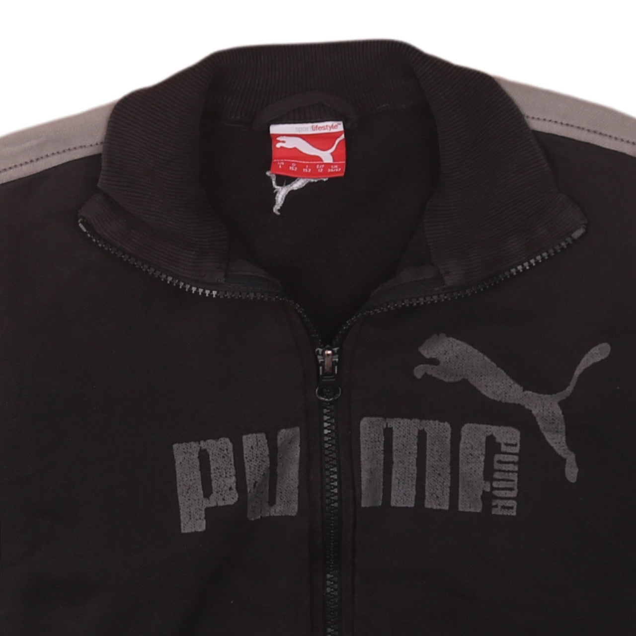 Brand and care label for Puma boys’ black track jacket, size 12, years full zip logo sportswear