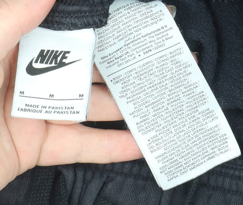 Brand and care label for Nike Men Black Jogger Sweatpants M Fleece Regular Fit Activewear