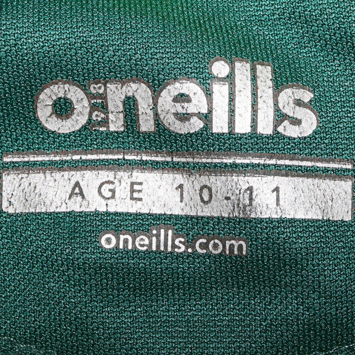 Brand and care label for O'Neill boys’ green & navy 1/4 zip faughs gaa hoodie age 10-11