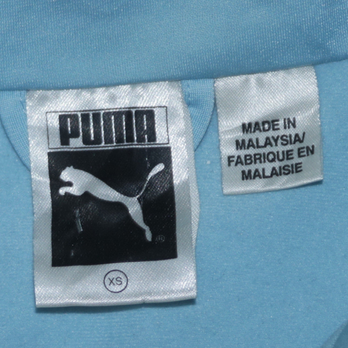 Close-up detail of Puma Women’s Blue Full Zip Hoodie XS Orange Trim Athletic Fit