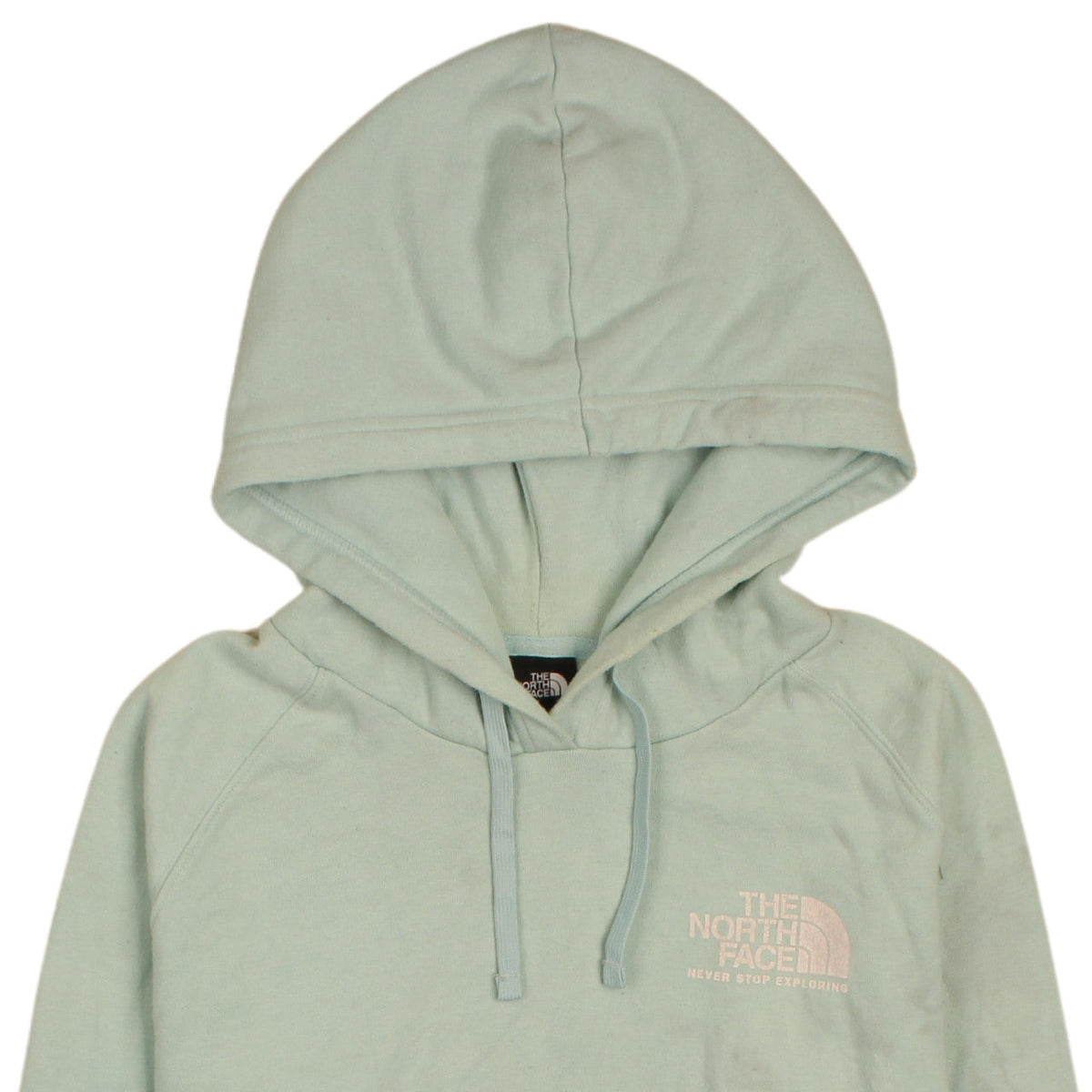 Brand and care label for The North Face women’s green pullover hoodie, size L, relaxed fit