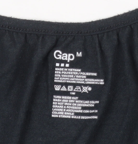 Brand and care label for Gap women’s black rhinestone scoop neck sleeveless t-shirt, size M