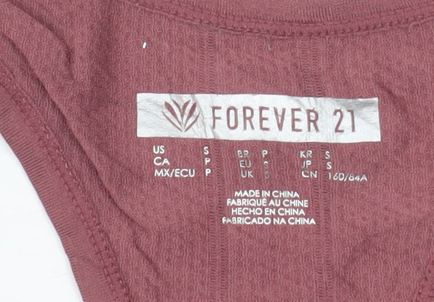 Brand and care label for Forever 21 women’s pink racerback tank top s slim fit activewear
