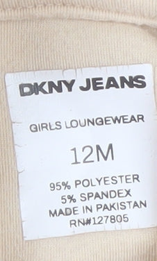 Brand and care label for DKNY Jeans girls’ beige hooded short sleeve casual top 12 months polyester blend