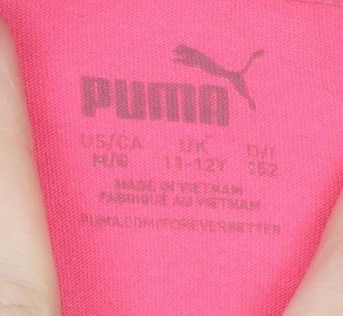 Brand and care label for Puma girls’ pink short sleeve crew neck t-shirt 11-12 years