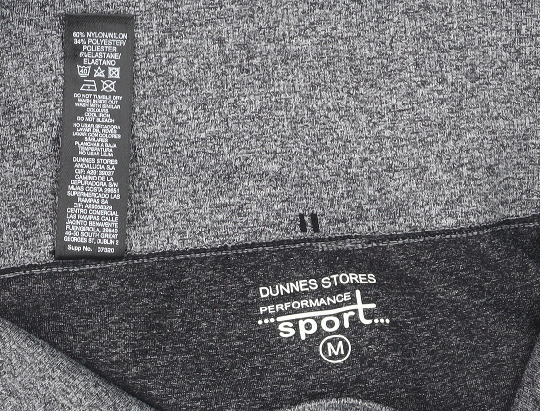 Brand and care label for Dunnes women’s grey seamless performance leggings m