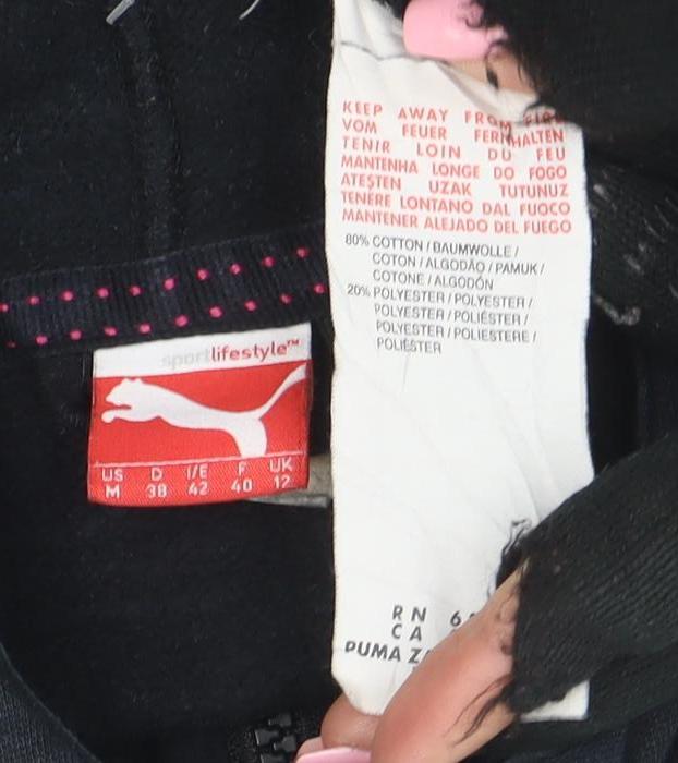 Brand and care label for Puma women’s black full zip hoodie, size UK 12, cotton blend sportswear