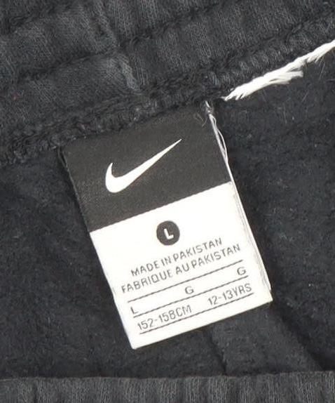 Brand and care label for Nike boys’ black 12-13 years jogger activewear trousers