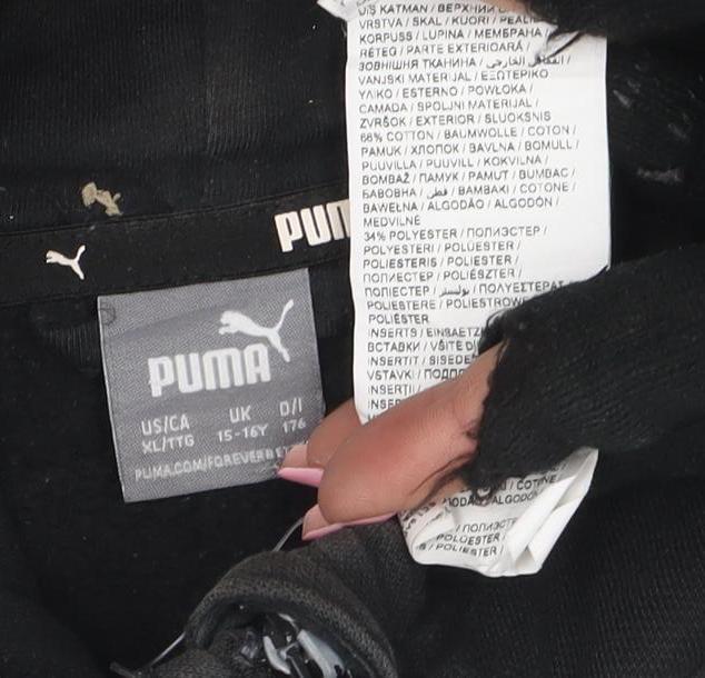 Brand and care label for Puma boys’ black full zip hoodie, size 15-16, years sportswear logo