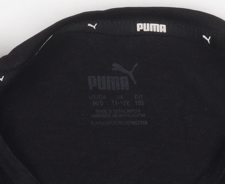 Brand and care label for Puma girls’ black short sleeve crew neck logo t-shirt, size 11-12, years