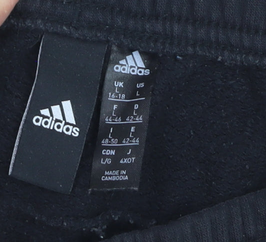 Brand and care label for Adidas boys’ black jogger trousers, size 16, years activewear track pants