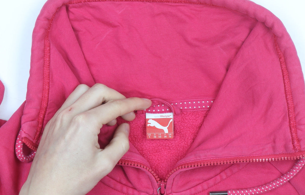 Brand and care label for Puma women’s pink full zip hoodie, size UK 10, cotton fleece warm casual