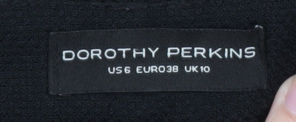 Brand and care label for Dorothy Perkins women’s black slim tapered trousers, size UK 10
