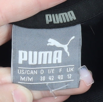 Brand and care label for Puma women’s black, size UK 12, pullover hoodie with logo print