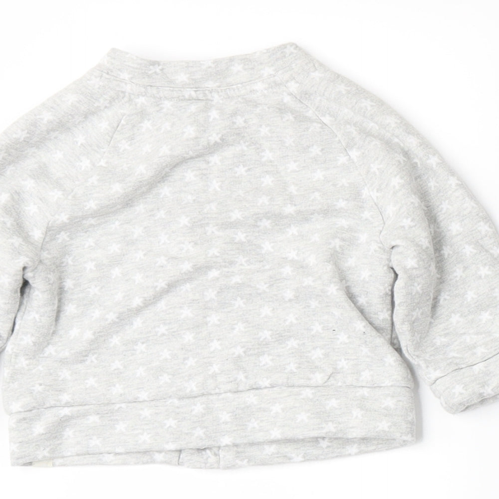 Brand and care label for Mothercare girls’ grey jacket, size 3-6, months