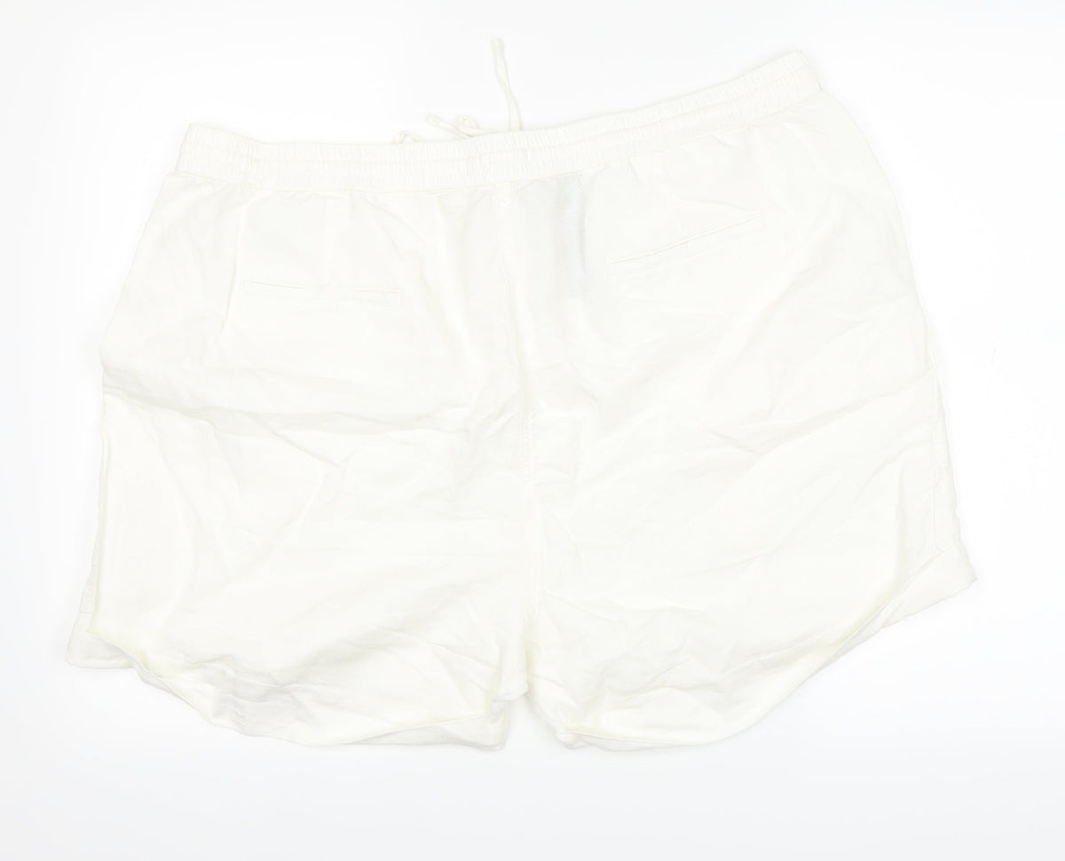 Back view of Marks & Spencer women’s white cargo shorts, size UK 22, in