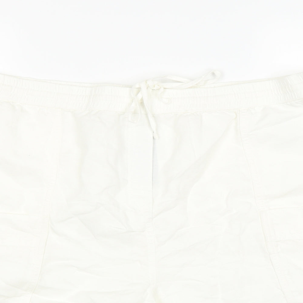 Close-up detail of Marks & Spencer women’s white cargo shorts, size UK 22, in
