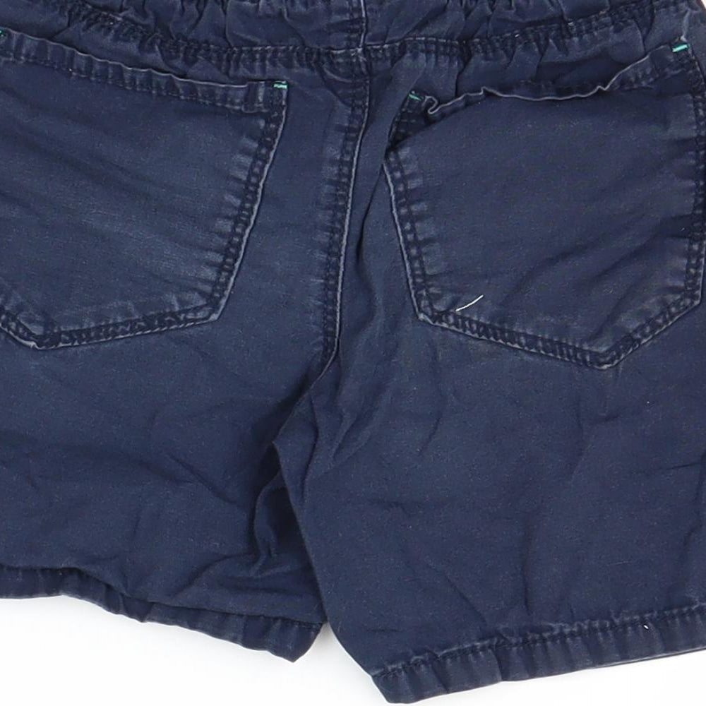 Brand and care label for Rebel boys’ blue chino shorts, size 2-3, years