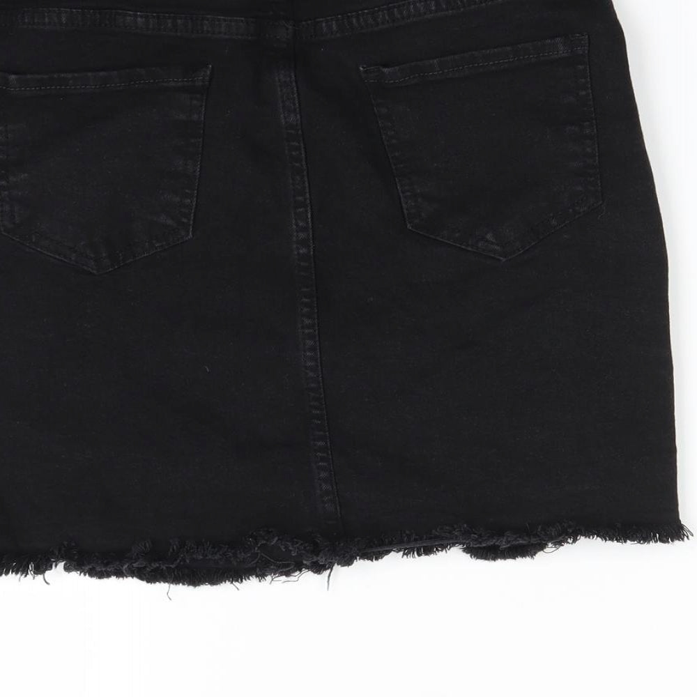 Brand and care label for Nasty Gal women’s black mini skirt, size UK 8