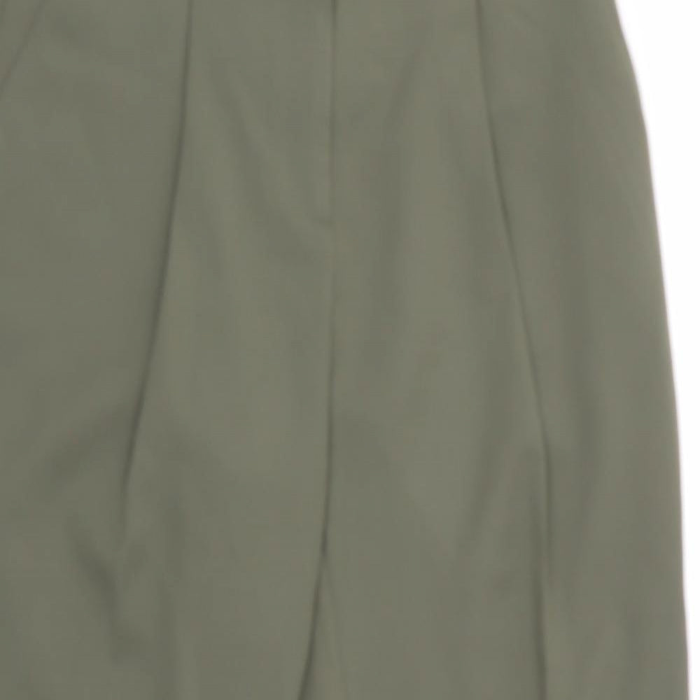 Close-up detail of NewLook women’s green houndstooth trousers, size UK 8