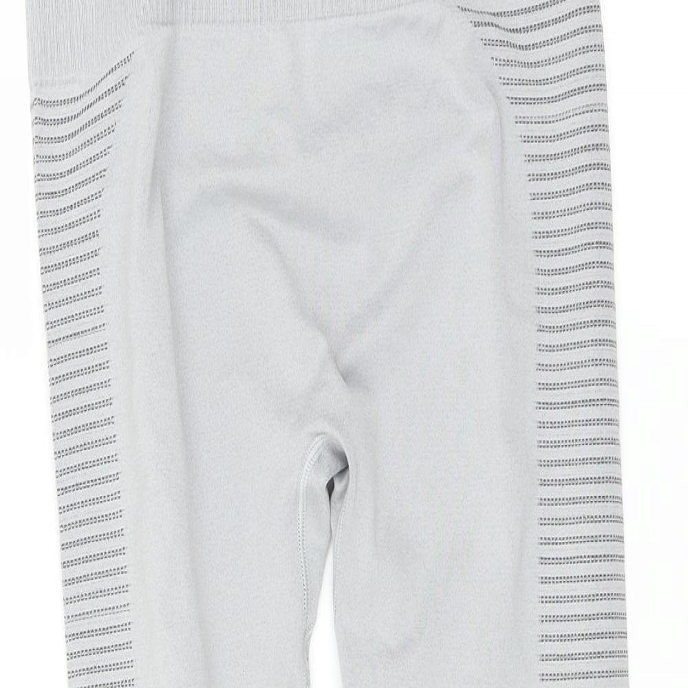 Close-up detail of Preworn women’s grey compression leggings, size L, 27-inch leg