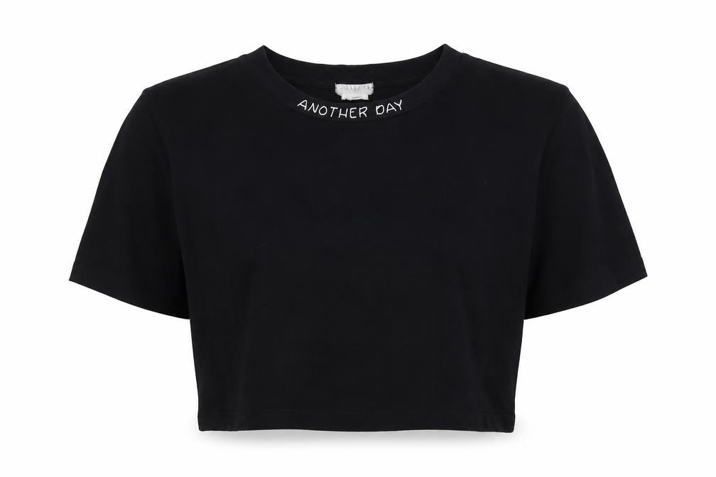 Front view of Cooperative women’s black cropped t-shirt, size M