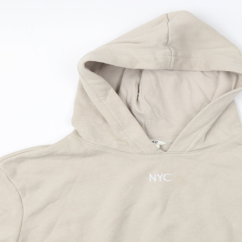 Close-up detail of H&M girls’ beige pullover hoodie, size 10-11, years