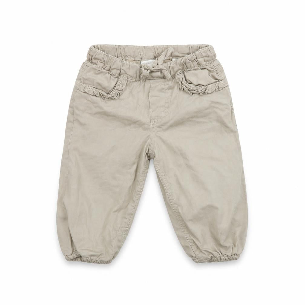 Front view of H&M girls’ beige cropped trousers, size 12, months