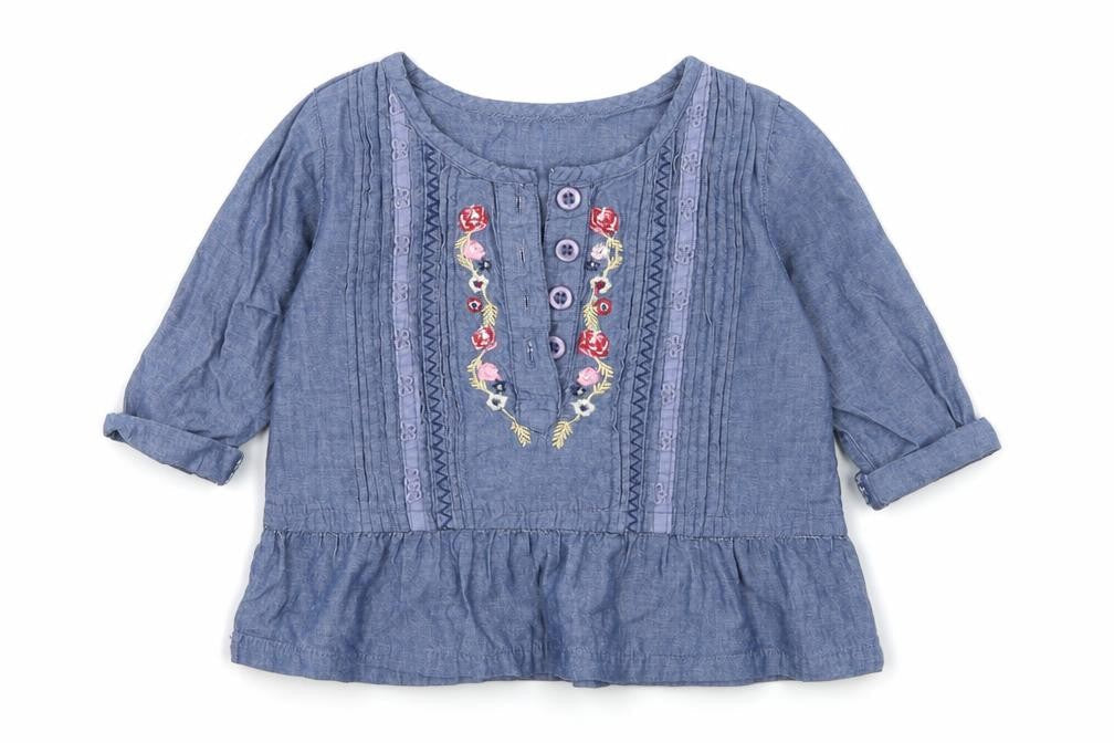 Front view of Matalan girls’ blue denim basic t-shirt, size 6-9, months
