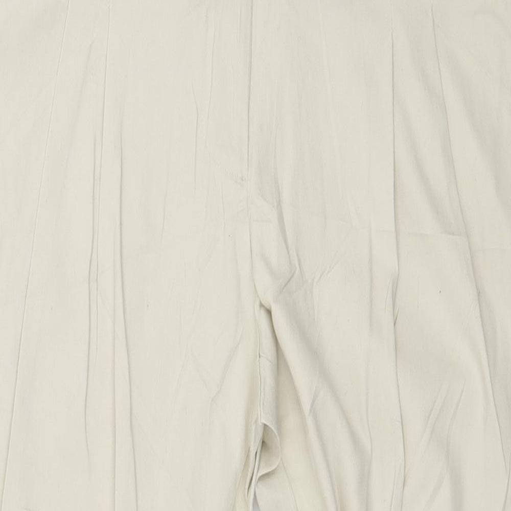 Close-up detail of Flame women’s beige trousers, size UK 12, 28-inch leg