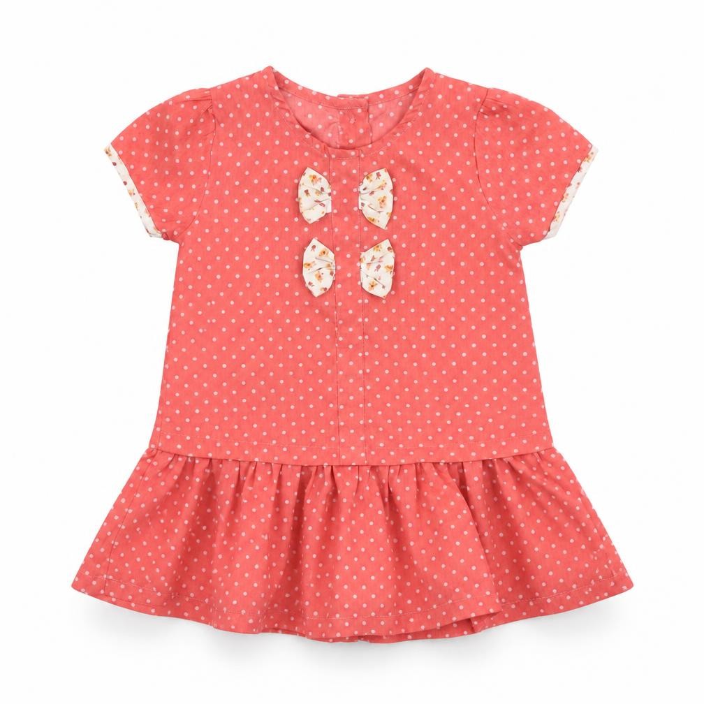 Front view of Preworn girls’ pink spotted fit & flare, size 12, months