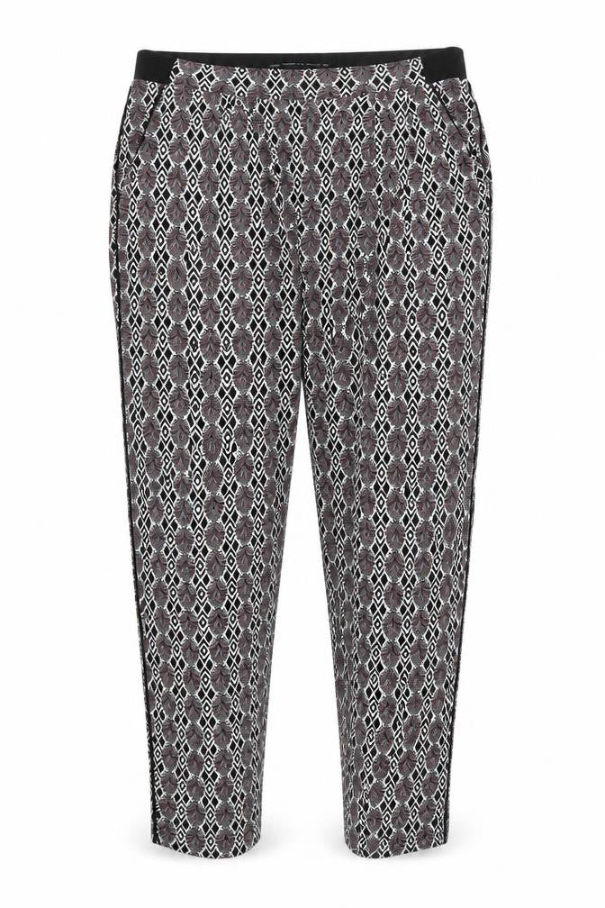 Front view of Next women’s black argyle/diamond trousers, size UK 10, 29-inch leg - stretch waistband